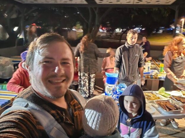 Southport homeless outreach leader Josh Kilburn with other volunteers helping to feed disadvantaged residents in the CBD.