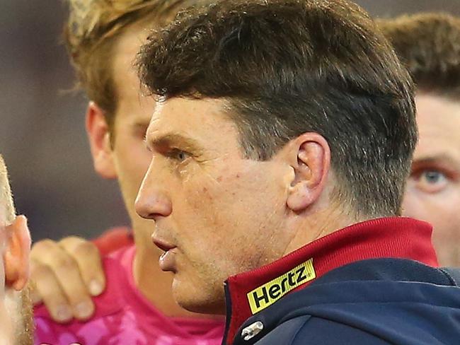 MELBOURNE, AUSTRALIA - MAY 10: Paul Roos the coach of the Demons talks to his players during the round eight AFL match between the Melbourne Demons and the Western Bulldogs at Melbourne Cricket Ground on May 10, 2014 in Melbourne, Australia. (Photo by Quinn Rooney/Getty Images)