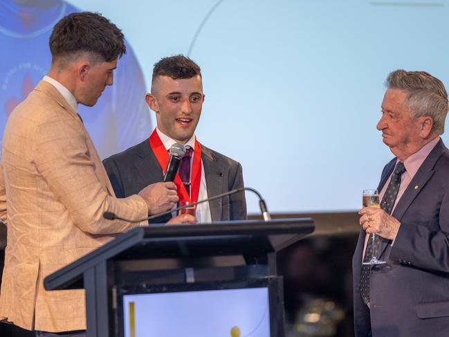 Jake Toeroek (middle) is awarded the John Letts Medal on Saturday night. Picture: Makoto Kaneko