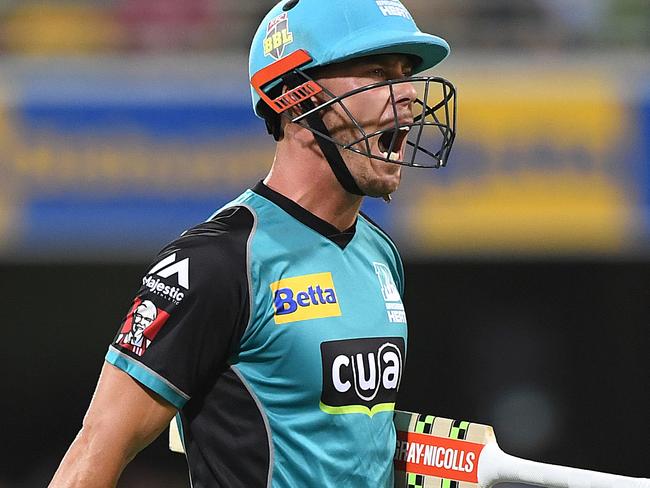 Chris Lynn walks after he is caught out against the Renegades at the Gabba.