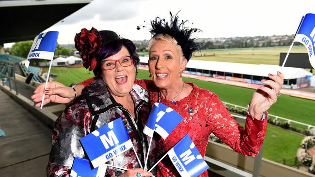 Two of Winx co-owners Debbie Kepitis and Patty Tighe with Go Winx flags. Picture: Kylie Else