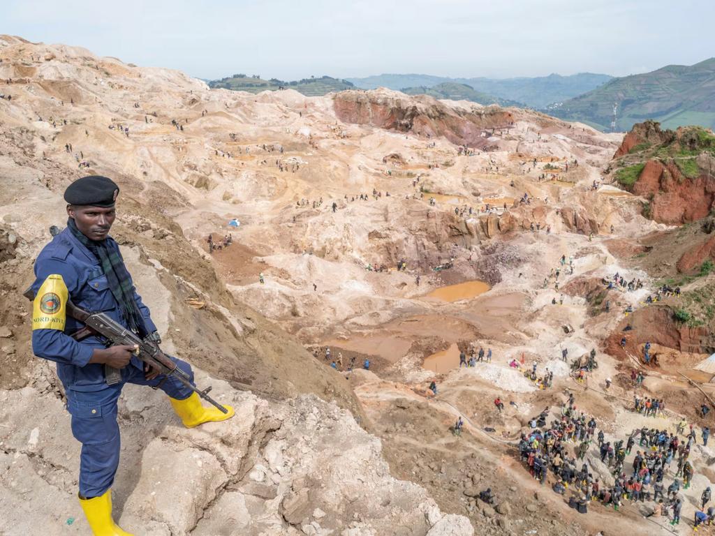 A policeman watches over a coltan mine in Rubaya, Congo. Photo: Veronique de Viguerie/Paris Match/Getty Images