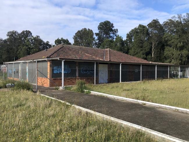 The dilapidated former North Manly Bowling Club and overgrown greens on Monday, which is proposed to be demolished to make way for the Manly Warringah Gymnastics Club Centre of Excellence. Picture: Jim O’Rourke