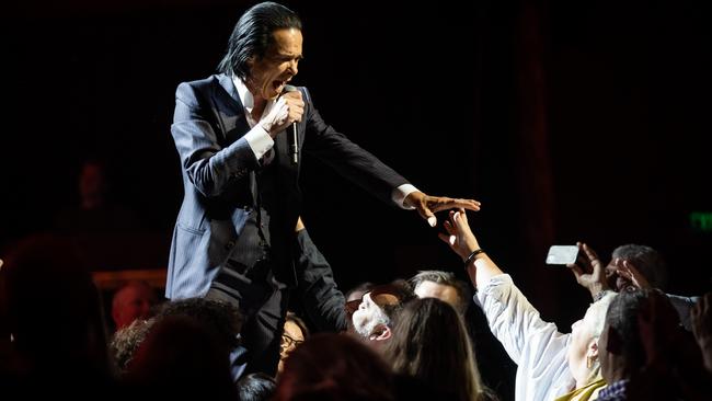 Nick Cave reaching out at Sydney Opera House. Pictures: Daniel Boud