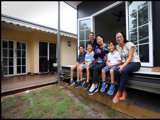 Mark Herrington and partner Grace Song with childrenElias 10,  Sebastian 8,  Luis 5 Caperna with their  grandmother Joosook Lee with their Granny flat that are making a comeback in Brisbane, in part due to the relaxed planning laws in this space (no DA required) but also in part to the sizeable value-add they bring to a property. And theyÕre architectural stunners in their own right. Arkspace Architects have completed their new granny flat prototype design in Chelmer Ð a build time of just 8 weeks - and it has increased the value of the property by 25%. Photo of Grace Song, architect for Arkspace with her kids at the granny flat in chelmer. Please get some different options as I will use for digital too.Pic Jamie Hanson