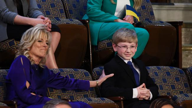 US First Lady Jill Biden reaches out to 13-year-old diabetes patient and advocate Joshua Davis of Midlothian, Virginia during President Joe Biden's State of the Union address to a joint session of the US Congress. Picture: AFP