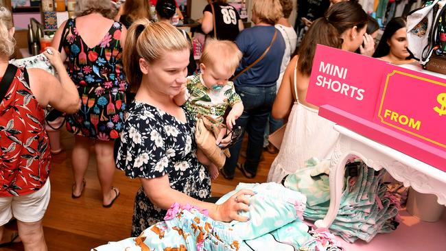 Breanna Beale with nephew Felix Hirst check out the sales in Peter Alexander. Picture: Tony Martin.