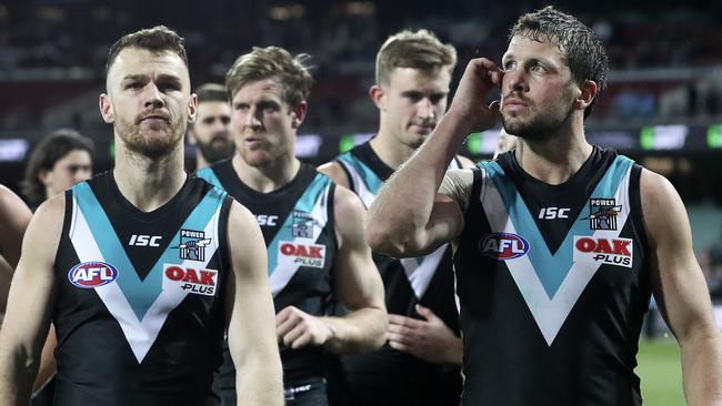 Port Adelaide captain Travis Boak scratches his head as he leads the team off after the loss to the Bomebrs on the final game of the season. PICTURE SARAH REED