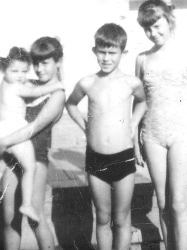 Pictures taken from book "Icons of Australian Music: Jimmy Barnes" the life story of singer Jimmy Barnes - Jimmy Barnes as a young child with siblings Lisa, Linda and Dot.