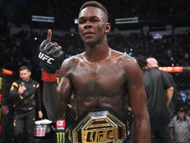 HOUSTON, TEXAS - FEBRUARY 12: Israel Adesanya of Nigeria reacts after defeating Robert Whittaker of Australia by unanimous decision in their UFC middleweight championship fight during the UFC 271 event at Toyota Center on February 12, 2022 in Houston, Texas. (Photo by Josh Hedges/Zuffa LLC)