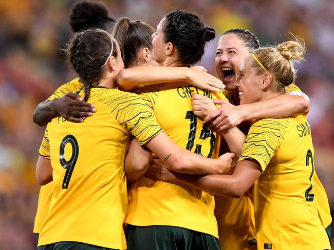 BRISBANE, AUSTRALIA - MARCH 03:  Emily Gielnik of Australia is congratulated by team mates after scoring a goal during the 2019 Cup of Nations match between Australia and the Korea Republic at Suncorp Stadium on March 03, 2019 in Brisbane, Australia. (Photo by Bradley Kanaris/Getty Images)