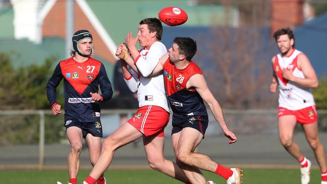 Bryce Alomes (Clarence) and Bradley Young (North Hobart) contest the footy on Saturday. Picture: Nikki Davis-Jones