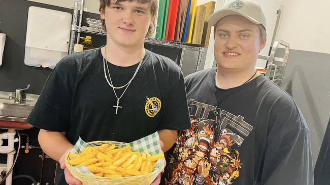 Territory True participant Bailey Briggs, who cooked the inaugural basket of fries, with Territory True Cafe manager Tom McMaster. Picture: Facebook