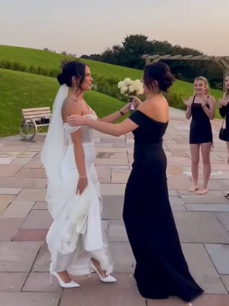 She gave her friend the bouquet, before spinning her around to face her boyfriend … Picture: TikTok