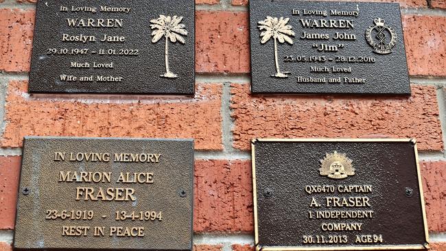 The memorial plaque of Captain Alexander “Lex” Fraser of the 1st Independent Company beside wife Marion Alice Fraser, daughter Roslyn Warren and her husband, James, at the Holy Trinity Anglican Church on McIlwraith Street, Ingham. Picture: Cameron Bates