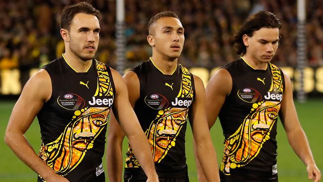 Shane Edwards, Shai Bolton and Daniel Rioli walk to the coin toss before Dreamtime at the ‘G last night. Picture: Getty Images