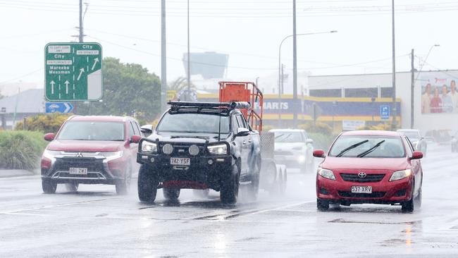 Showers and rain has finally arrived in Cairns and the Far North, affecting all coastal areas. Traffic drives along Mulgrave Road in the wet weather. Picture: Brendan Radke