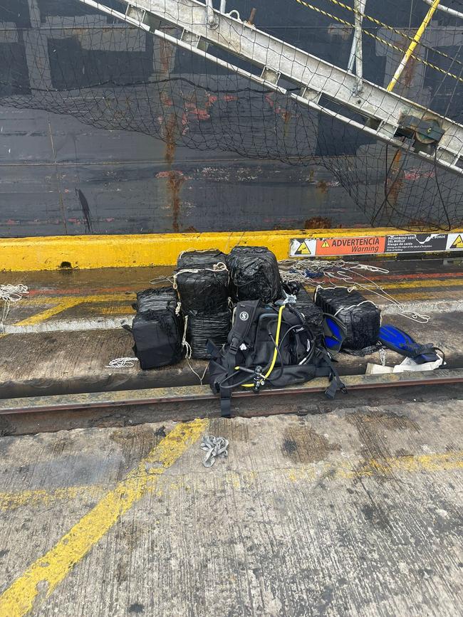 A video of one of the searches shows police divers removing a drug shipment bolted to the base of a ship in that port.