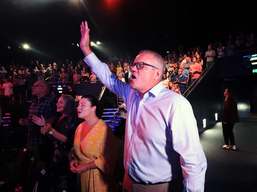 Prime Minister Scott Morrison with his wife Jenny on Easter Sunday at the Horizon Church in Sutherland. Picture Gary Ramage