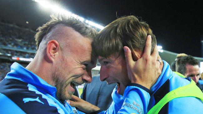 Jordy Buijs hugs Filip Holosko after the Sydney win. Picture: Mark Evans