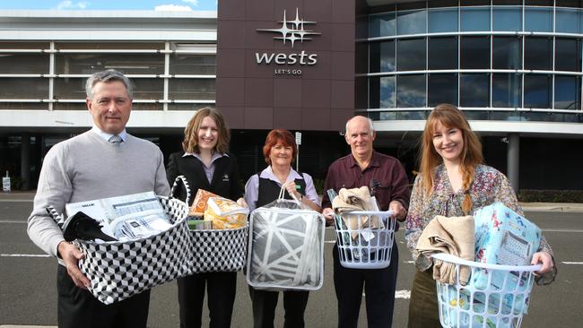 (L-R) Wests CEO Tony Mathew, Wests Leagues Marketing Assistant Elisha Dunn, MHSC members Cathy Chopping, Ken Barnard and Erin Redmond pose for a photo at Leumeah, Friday, 6th July 2018. Wests Macarthur Group is supporting “Do Something Day “ this year with an exciting partnership with Macarthur Homelessness Steering Committee (MHSC). (AAP Image / Robert Pozo).