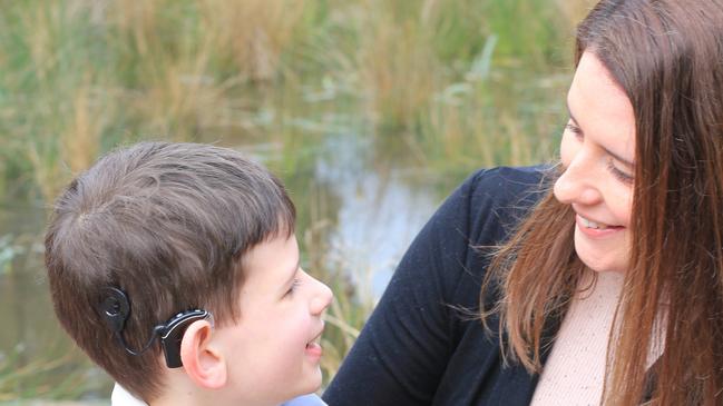 Henry Selby, 9, with mother Lisa. Henry’s cochlear implant was notprogrammed correctly. Picture: supplied by Lisa Selby