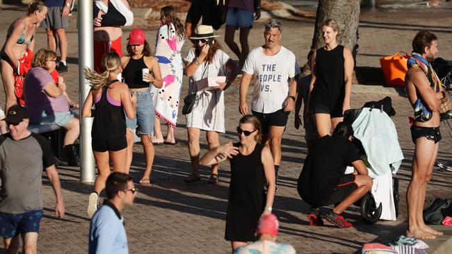 Social distancing fail: joggers, walkers and swimmers ignore crowd restrictions to throng Sydney’s beachside Manly on Friday. Picture: Matrix