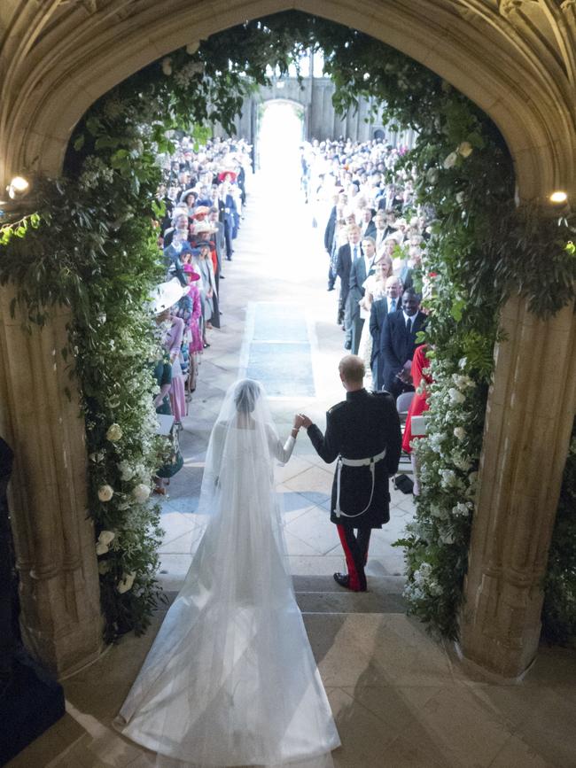 Meghan Markle and Prince Harry walking down the aisle. Picture: AP