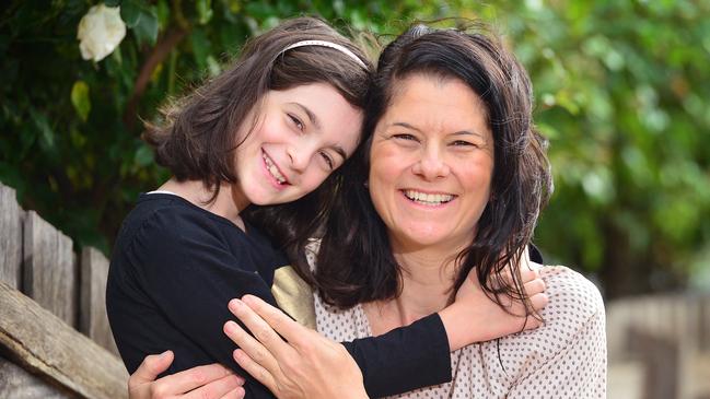 Pannee Agathos and daughter Alex, 8, are happy about the fee relief offer for Catholic school families. Picture: Nicki Connolly