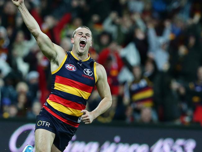 Sarah Reed pictures of the year 2014 . 29/06/2014 CHP: 29/06/2014 CHP: AFL - Adelaide Crows v Port Adelaide, Showdown 37 at Adelaide Oval. Brad Crouch jumps over Matthew Broadbent to celebrate his goal. Photo Sarah Reed.