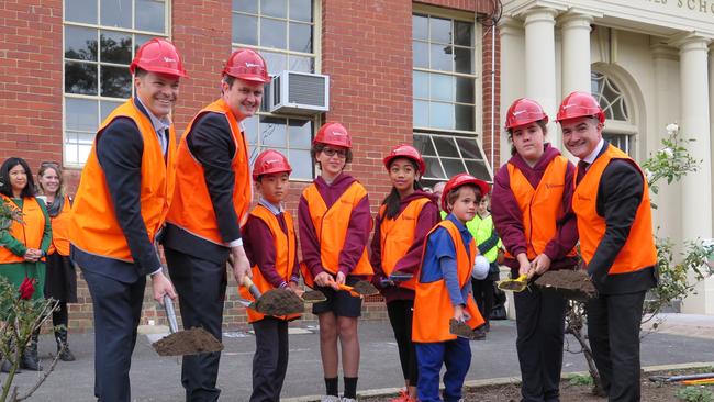 Preston West Primary students turn the first sod with Preston High principal Sean Butler (left),MP Robin Scott and Education Minister James Merlino.