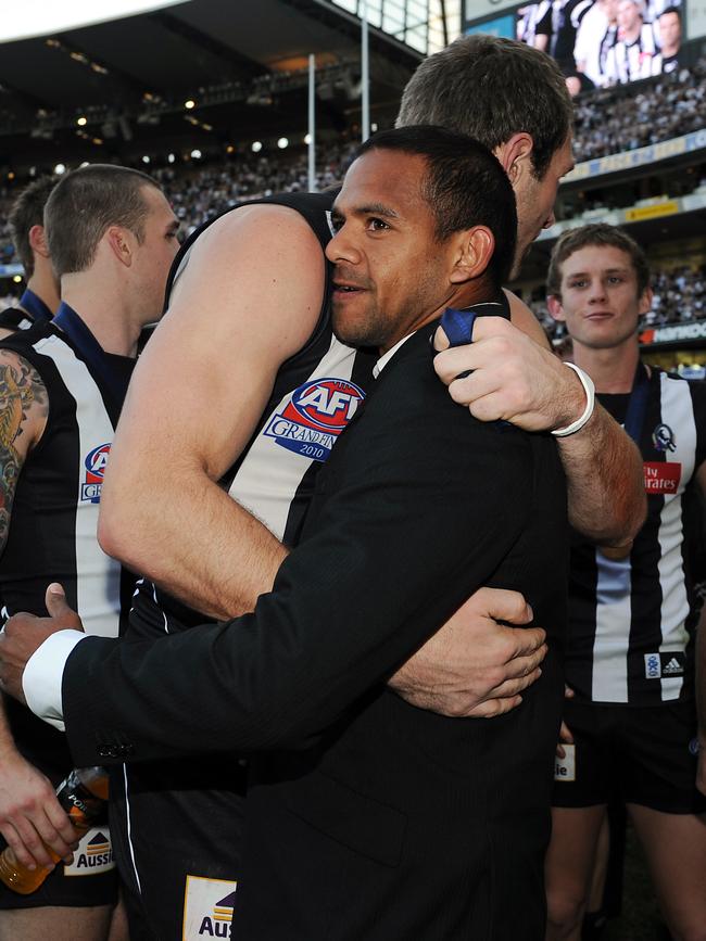 Leon Davis gets a hug from Travis Cloke.