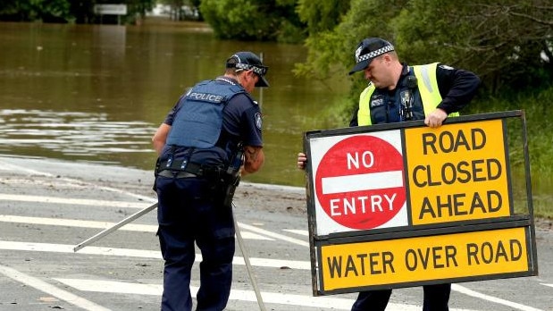 Students and staff told to stay home as heavy rains continue to pound southeast Queensland.