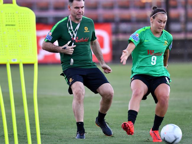 Matildas coach Ante Milicic (left) and Caitlin Foord (right) are seen during training at Lions FC Stadium in Brisbane, Saturday, February 23, 2019. The Australian Matildas are preparing to play in the inaugural Cup of Nations against Argentina, Korea Republic and New Zealand. (AAP Image/Darren England) NO ARCHIVING