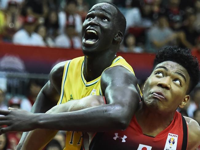 CHIBA, JAPAN - JUNE 29:  Rui Hachimura of Japan struggles against Thon Marial Maker of Australia during the FIBA World Cup Asian Qualifier Group B match between Japan and Australia at Chiba Port Arena on June 29, 2018 in Chiba, Japan.  (Photo by Matt Roberts/Getty Images)