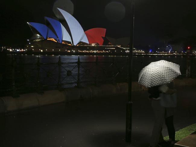 Solidarity ... Sydney’s Opera House was adorned with the red, white and blue of France’s flag.