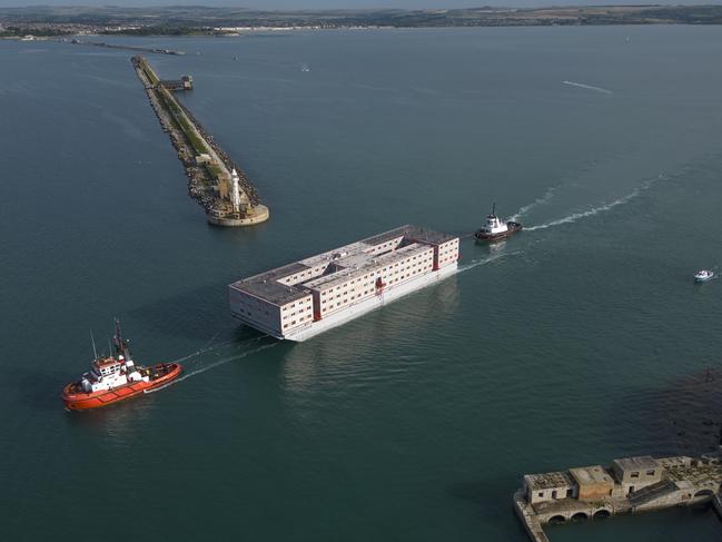 The Bibby Stockholm barge, which has been refitted to serve as living quarters for up to 500 asylum seekers to the UK, arrives at Portland Harbour on England’s south coast. Picture: Dan Kitwood / Getty Images