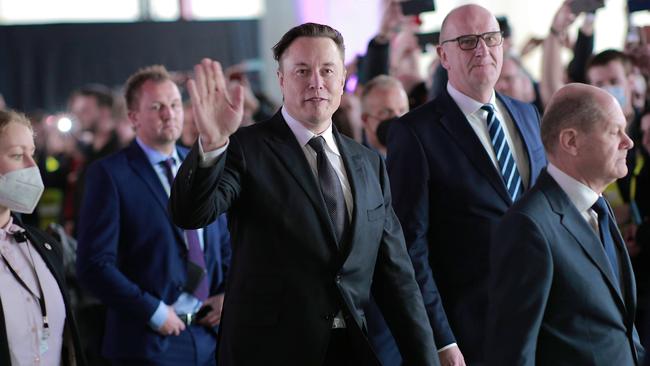 Elon Musk, centre, in Germany earlier this year. His purchase of Twitter may come to be seen as a defining moment in the new epoch of social media. Picture: Getty Images