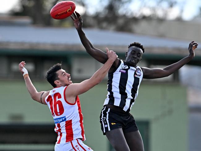 WRFL: Parkside’s John Atar jumps over North Footscray’s Samuel Nix. Picture: Andy Brownbill