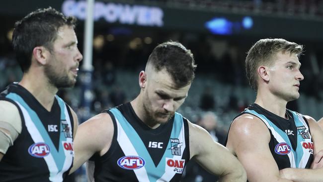 Port Adelaide’s Travis Boak, Robbie Gray and Ollie Wines after Friday’s loss to Essendon. Picture: Sarah Reed