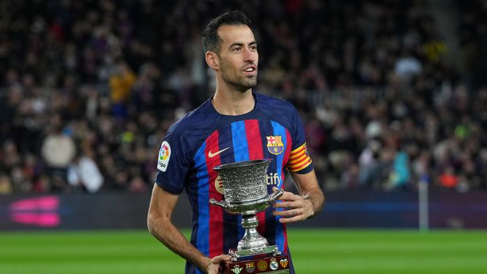 BARCELONA, SPAIN – JANUARY 22: Sergio Busquets of FC Barcelona presents the Spanish Supercopa Trophy to the fans prior to the LaLiga Santander match between FC Barcelona and Getafe CF at Spotify Camp Nou on January 22, 2023 in Barcelona, Spain. (Photo by Alex Caparros/Getty Images)