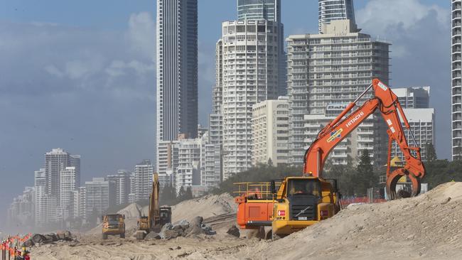 Earthmoving equipment on the sand at Narrowneck continue with their seawall works in 2016. Picture Glenn Hampson