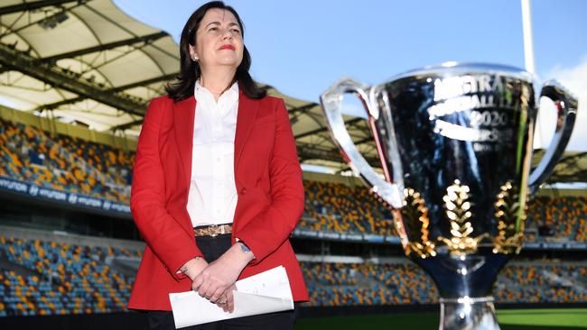 Premier Palaszczuk with the AFL premiership trophy at the announcement that Brisbane would host the decider. Picture: Dan Peled