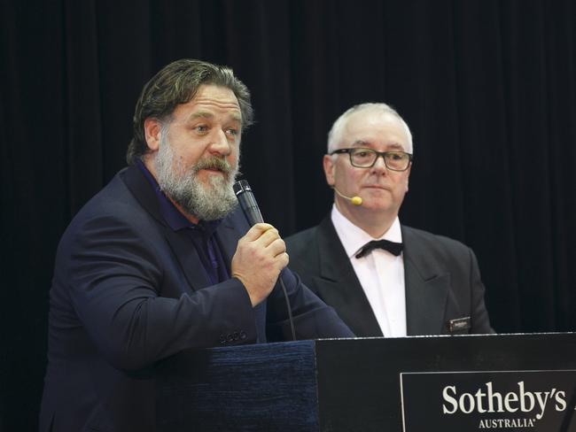 Russell Crowe with Sotheby’s auctioneer The Art of Divorce. Picture: Tim Pascoe