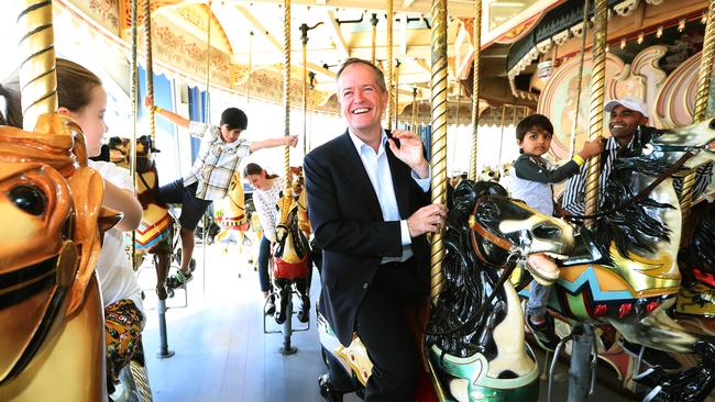 Bill Shorten riding the carousel at Luna Park in Melbourne. Picture: Kym Smith