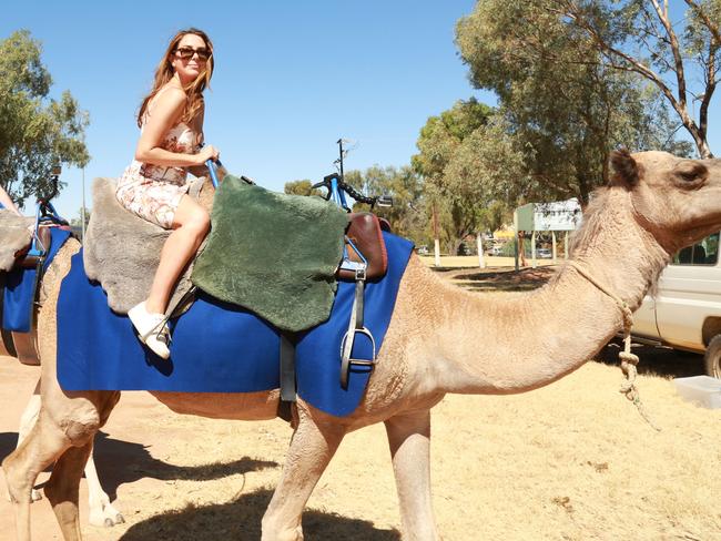 The radio host wanted a photo with the camel — but she almost came unstuck. Picture: Nova