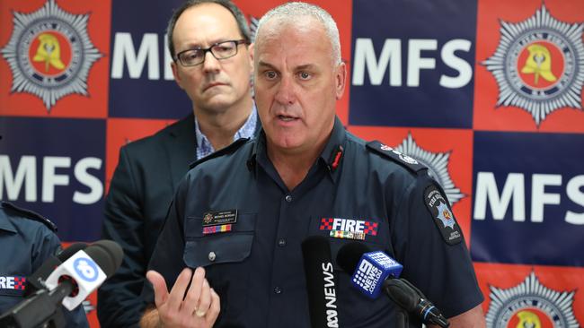 Former Emergency Services Minister Corey Wingard behind Chief Officer Michael Morgan. 8 December 2018. (AAP Image/Dean Martin)