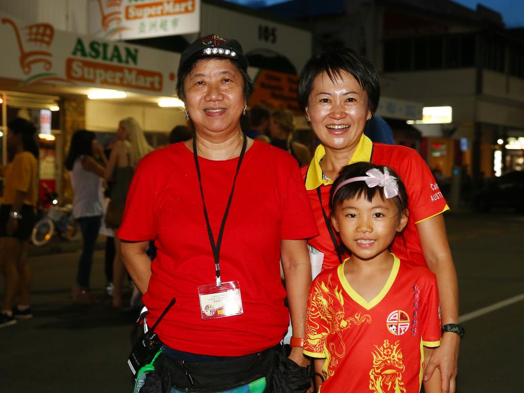 Lai Chulchan, Jasmine Cho, 6, and Chiemi Nono at the Cairns and District Chinese Association Inc Chinese New Year street festival on Grafton Street. PICTURE: BRENDAN RADKE