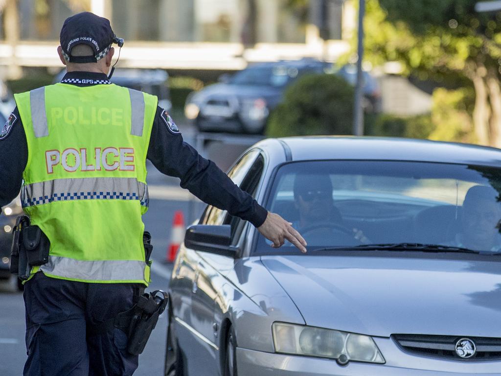 Police check cars on the NSW-Queensland border. Picture: Jerad Williams