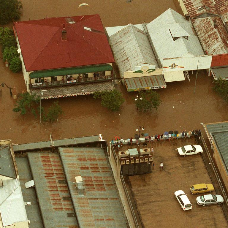 Residents watch from the rooftops as Gympie floods, Februay 9, 1999. Photo: Nathan/Richter